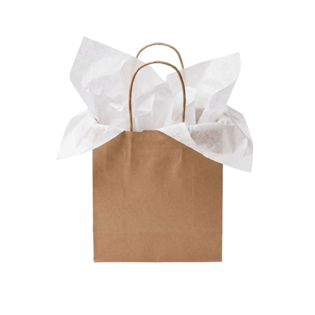 A brown kraft paper gift bag with two twisted paper handles, filled with crumpled white tissue paper, isolated on a white background.