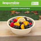 Brown compostable bowl filled with fruit on a wooden surface.