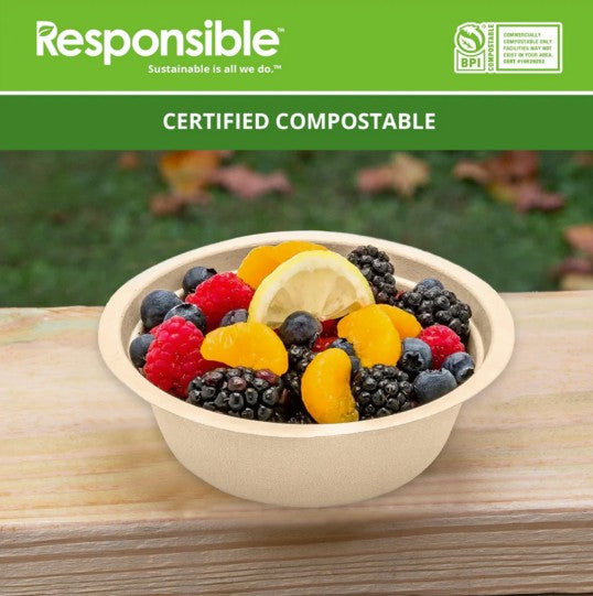 Fruit salad in a tan bowl on a wooden table.