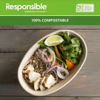 Salad in a bowl with a 'Responsible' label claiming 100% compostable packaging on a wooden surface.