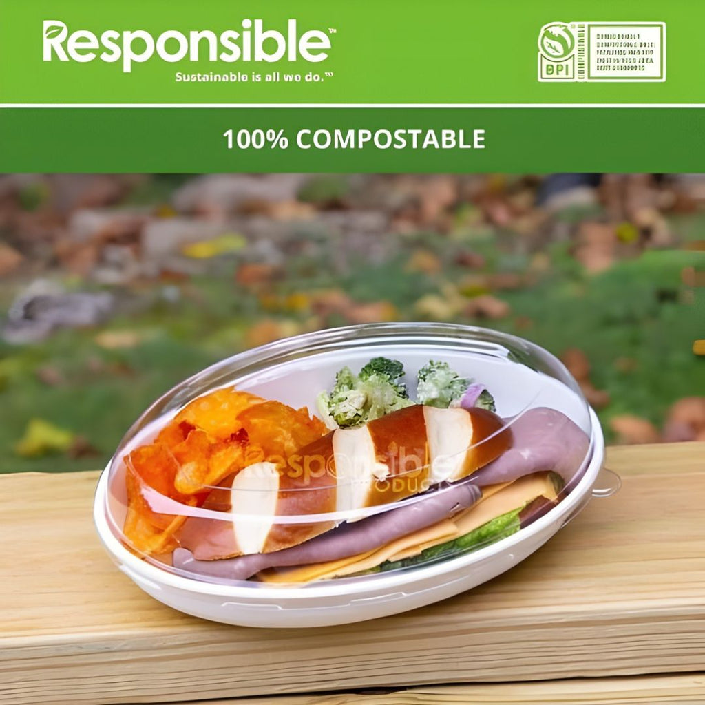 Compostable bowl with lid containing food on a wooden surface, featuring the 'Responsible' brand.
