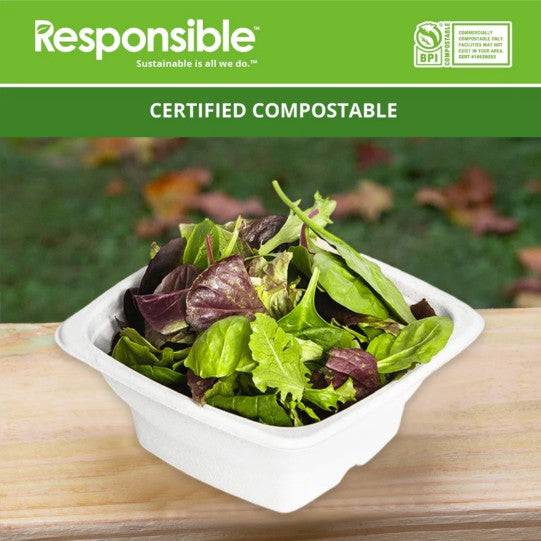 Compostable square bowl filled with lettuce on top of a wooden surface.