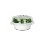 Clear plastic lid on a compostable white bowl with green salad on a white background