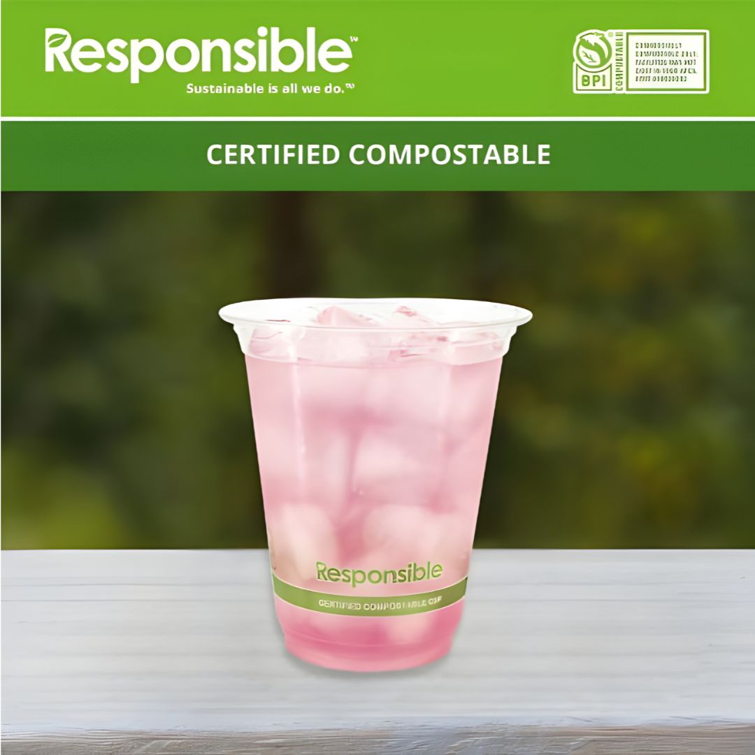 Certified compostable cup with pink drink on a blurred green background, featuring the 'Responsible' brand.