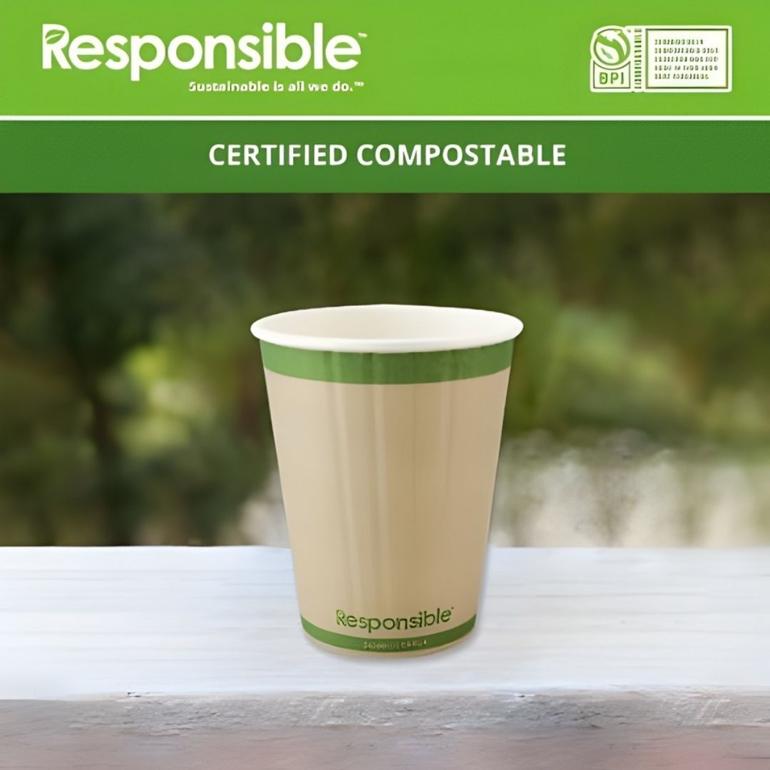 Compostable paper cup with green rim and 'Responsible' branding on a blurred natural background