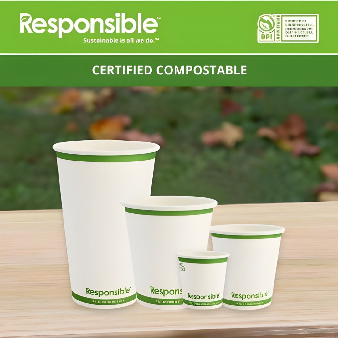 Set of compostable cups with 'Responsible' branding on a wooden surface.