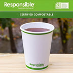 Compostable cup with a drink on a wooden surface, branded as 'Responsible Products'.