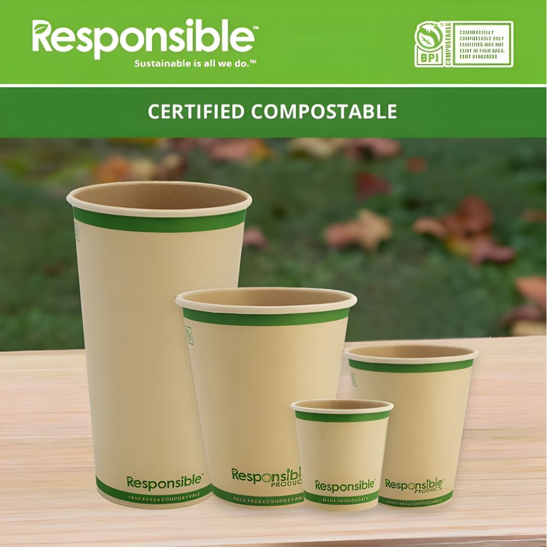 Set of compostable cups with 'Responsible' branding on a wooden surface.