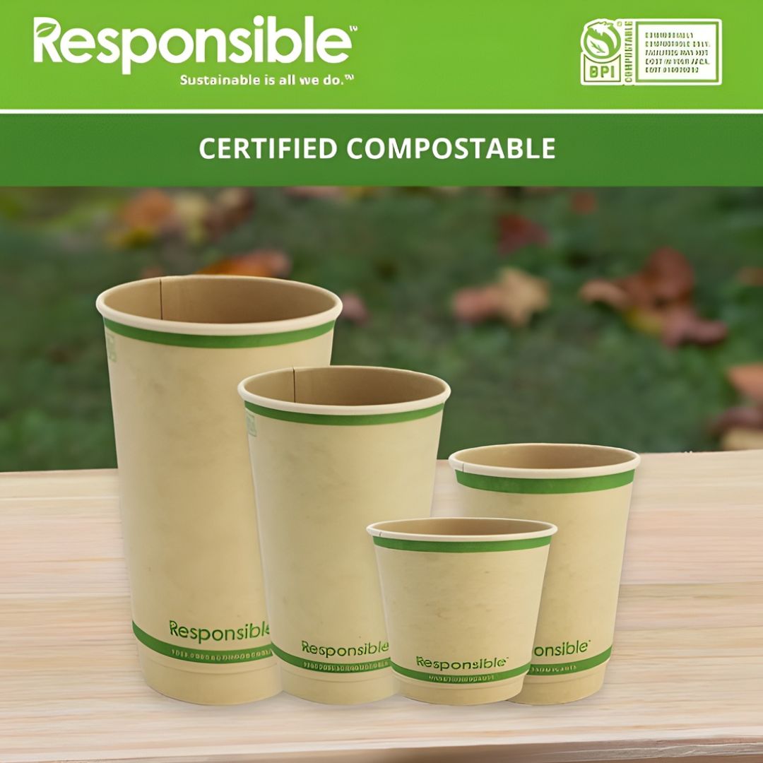 Set of compostable cups with 'Responsible' branding on a wooden surface.