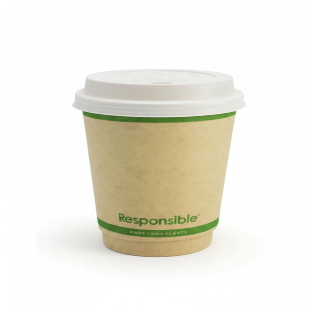 Compostable coffee cup with a white lid on a white background
