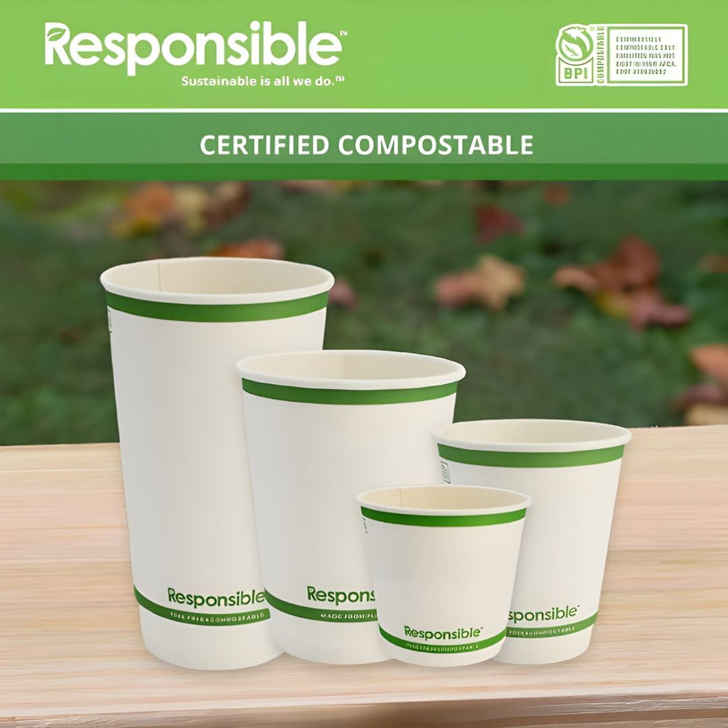 Set of compostable cups with 'Responsible' branding on a wooden surface.