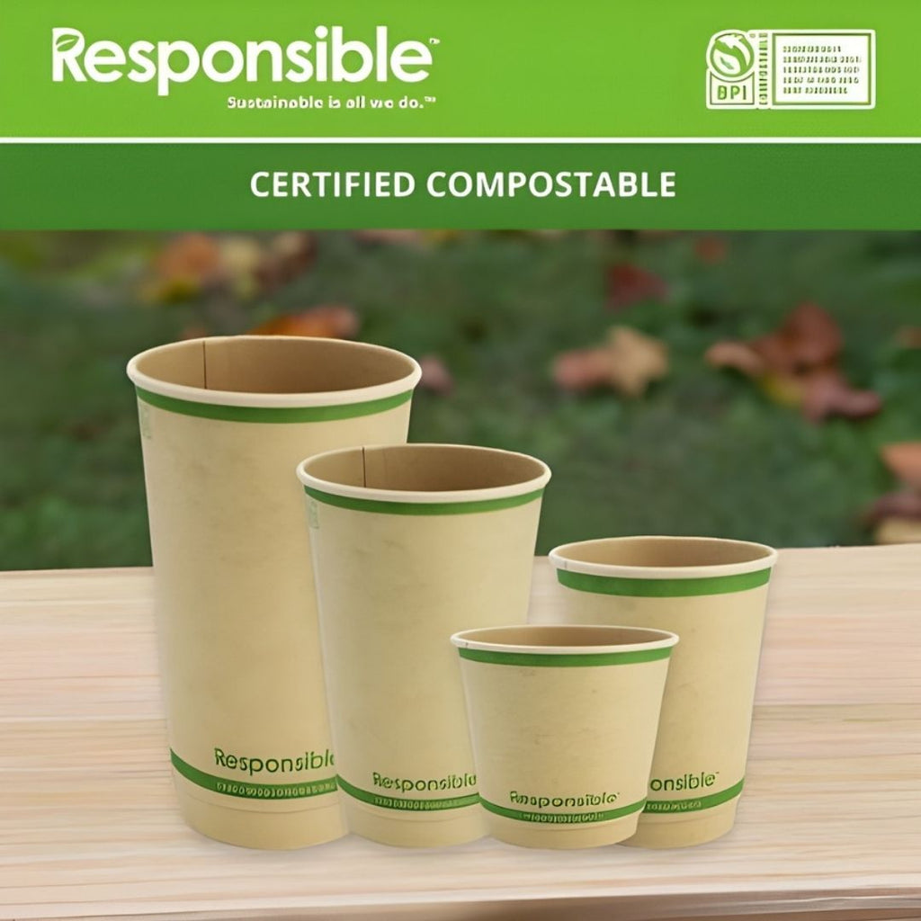 Set of compostable cups with 'Responsible' branding on a wooden surface.
