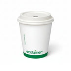 White paper cup with a green logo and a white hot cup lid on a white background