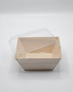 Wooden box with a clear plastic lid on a white background
