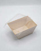 Clear plastic lid on a wood tray against a white background