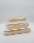 Set of three wooden trays with lids on a white background