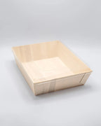 Wooden tray on a light gray background