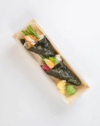 Two pieces of sushi in a rectangular dish with lid on a white background