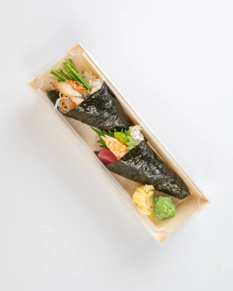 Two pieces of sushi in a rectangular dish with lid on a white background