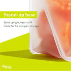 Transparent silicone container with food on a green background, featuring text about the stand-up base.