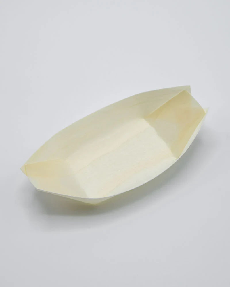 Beige paper boat on a light gray background