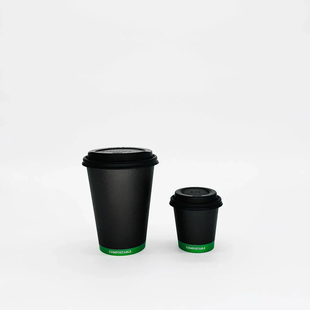 Two black compostable hot cups on a white background