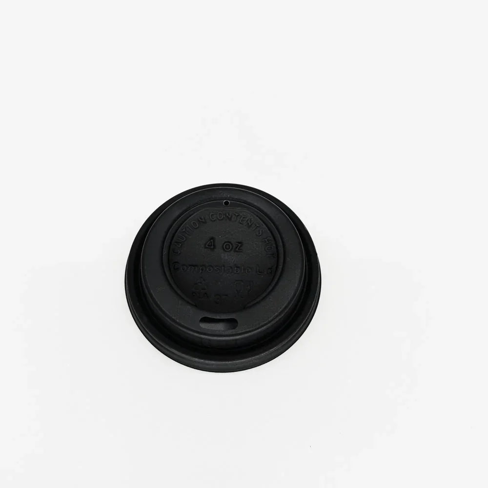 Black espresso cup lid on a white background
