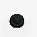 Black espresso cup lid on a white background