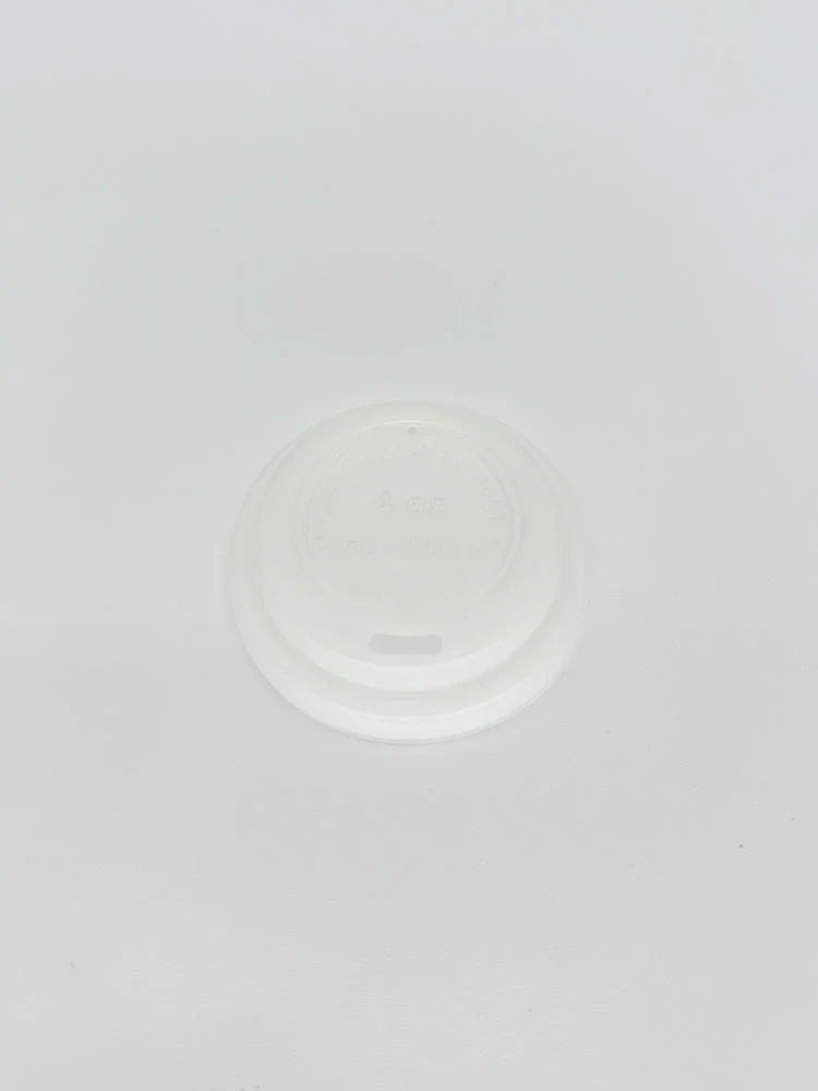 White 4 oz hot cup lid on a light gray background