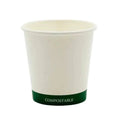 Compostable paper cup with green base on a white background