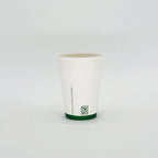 White paper hot cup with a green logo on a light gray background