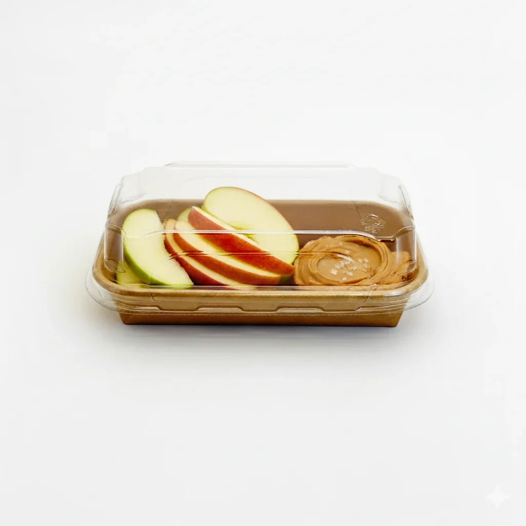 Rectangular container with lid containing sliced apples with peanut butter on a white background