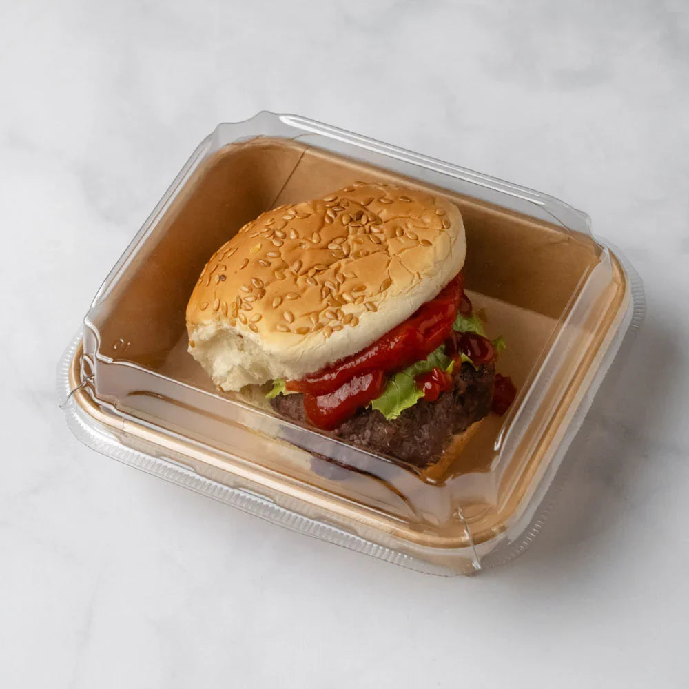 Hamburger in a takeout container on a white background