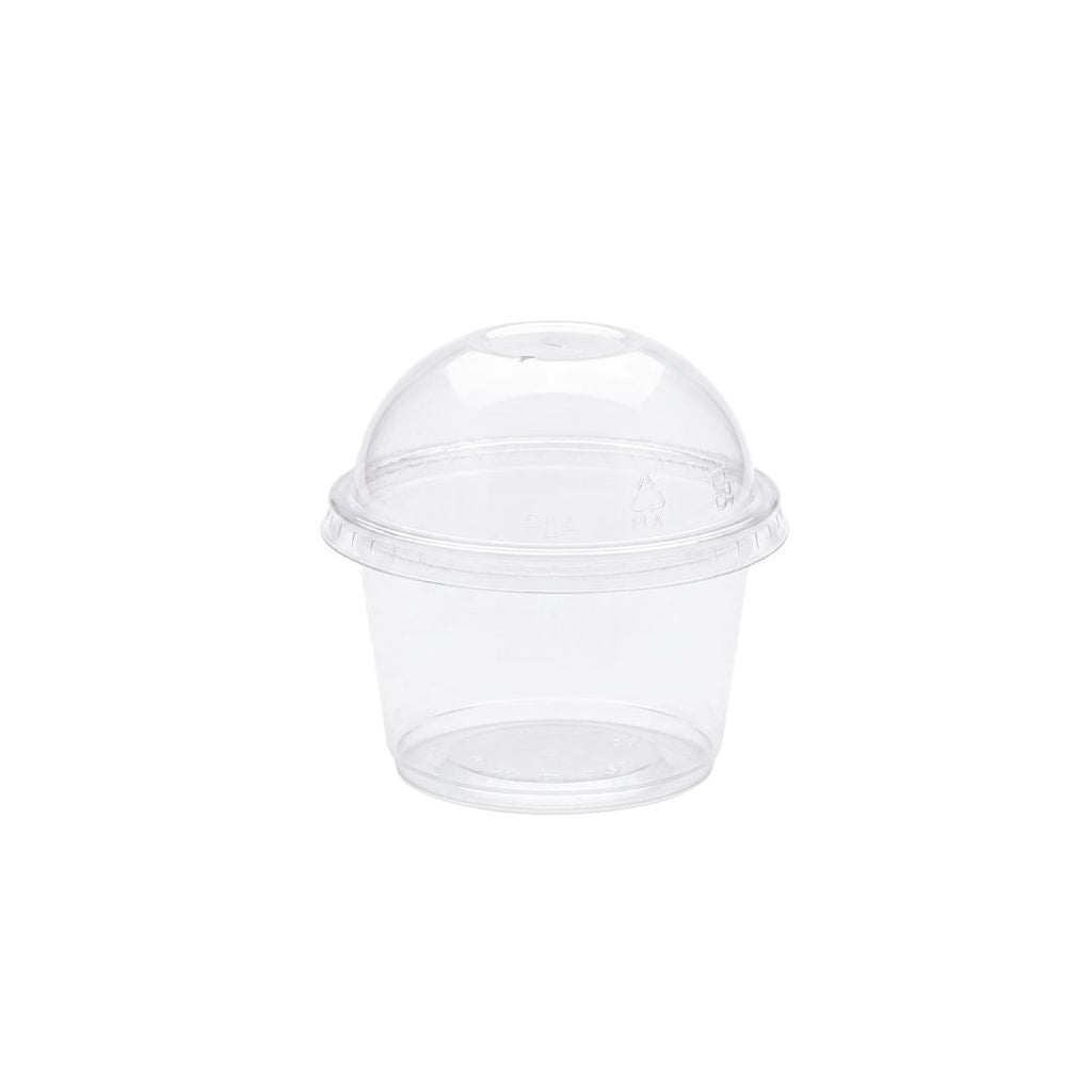 A clear portion cup with dome lid, on a white background.