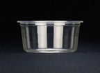 Clear portion cup on a black background