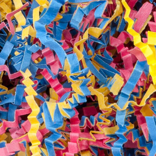 A close-up of multicolored shredded paper confetti in blue, pink, and yellow, filling the entire frame.