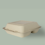 Closed compostable fiber clamshell with 3 compartments on a plain background.