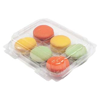 Clear box of 6 colorful macarons on a white background