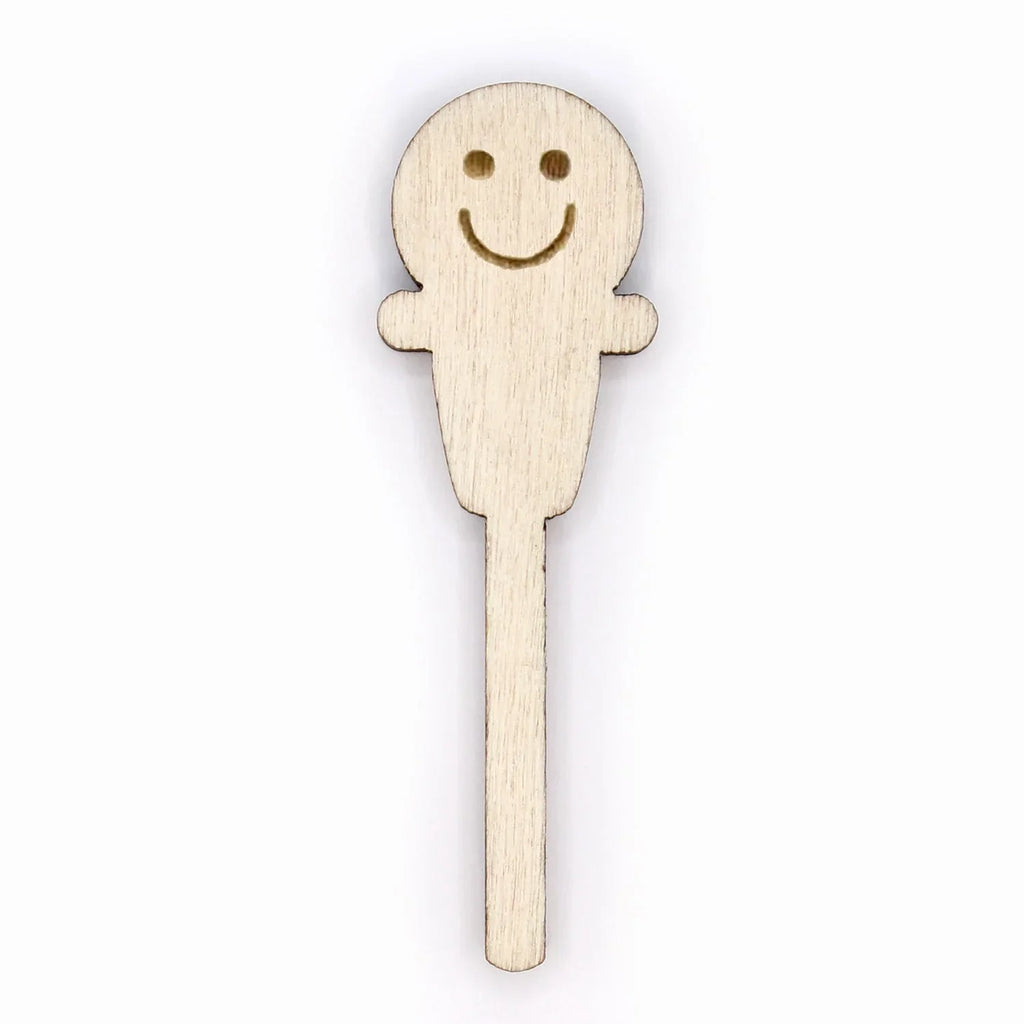 Wooden hot cup lid plug with a smiley face on a white background